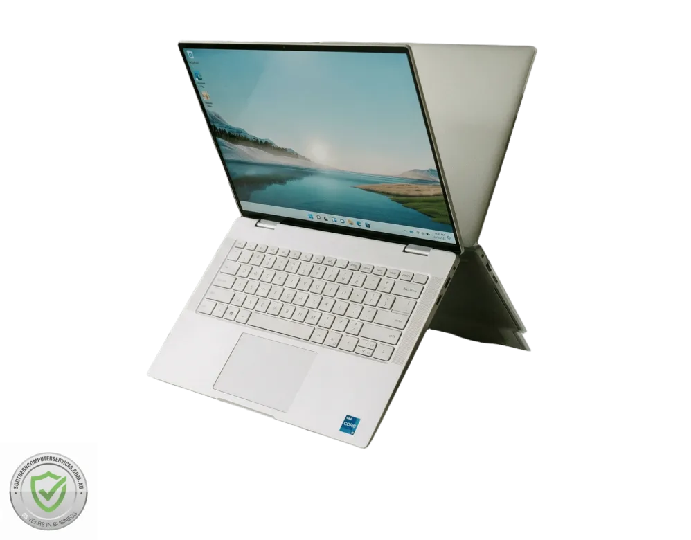 Laptop open against mirror